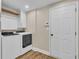 Bright laundry room with modern appliances and storage; a practical space at 2850 Dartmouth Pl, Cumming, GA 30041
