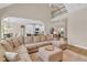 Spacious living room with open floor plan, plush sofa and view to the kitchen at 2850 Dartmouth Pl, Cumming, GA 30041
