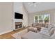 Comfortable living room with a stone fireplace, vaulted ceilings, and ample seating at 2850 Dartmouth Pl, Cumming, GA 30041