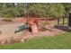Community playground featuring a slide, climbing wall, and swings, offering a fun space for children at 2850 Dartmouth Pl, Cumming, GA 30041