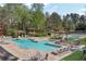 Community pool area with multiple pools, lounge chairs, and shaded cabanas for residents to enjoy at 2850 Dartmouth Pl, Cumming, GA 30041