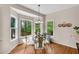 Cozy breakfast nook surrounded by windows offering natural light and views to the backyard at 3665 Evonvale Gln, Cumming, GA 30041
