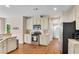 Bright kitchen with white cabinetry, granite countertops, and stainless steel appliances at 3665 Evonvale Gln, Cumming, GA 30041