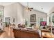 Inviting living room with hardwood floors, fireplace, and comfortable seating arrangement at 3665 Evonvale Gln, Cumming, GA 30041