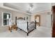 Bedroom boasting lots of natural light, trey ceilings, ceiling fan, carpet flooring, and warm paint at 3665 Evonvale Gln, Cumming, GA 30041