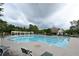 Community pool with lounge chairs, and outdoor structure overlooking the area at 3665 Evonvale Gln, Cumming, GA 30041