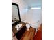 Bright bathroom features wood-look flooring, granite-look vanity, bathtub, and shower combo at 3735 Fir Dr, Buford, GA 30518