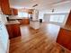 Open concept kitchen featuring an island, stainless appliances, and hardwood floors at 3735 Fir Dr, Buford, GA 30518