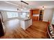 Open kitchen area with kitchen island, wooden cabinets, and stainless steel appliances at 3735 Fir Dr, Buford, GA 30518