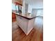 Kitchen island featuring a countertop and white cabinets at 3735 Fir Dr, Buford, GA 30518