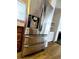 Stainless steel refrigerator with water and ice dispenser, with built-in shelving in the background at 3735 Fir Dr, Buford, GA 30518
