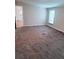 Spacious living room with neutral carpet, plenty of natural light, and is ready for furnishings at 3735 Fir Dr, Buford, GA 30518