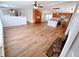 Spacious living room featuring an open floor plan, a stone fireplace, and modern appliances at 3735 Fir Dr, Buford, GA 30518