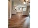 Open-concept living area with hardwood floors and fireplace at 3735 Fir Dr, Buford, GA 30518