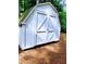 Exterior of storage shed featuring white siding and double barn doors at 3735 Fir Dr, Buford, GA 30518
