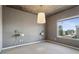 Modern bedroom with concrete ceiling and a large window showcasing a city view at 860 Peachtree Ne St # 1417, Atlanta, GA 30308