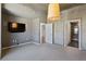 Spacious bedroom with a concrete ceiling and a doorway to an ensuite bathroom at 860 Peachtree Ne St # 1417, Atlanta, GA 30308