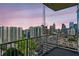 Balcony offers panoramic city views with lush greenery and a vibrant skyline, perfect for outdoor relaxation at 860 Peachtree Ne St # 1417, Atlanta, GA 30308