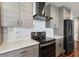 Updated kitchen with stainless steel appliances, gray cabinetry, and quartz countertops at 860 Peachtree Ne St # 1417, Atlanta, GA 30308