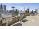 Outdoor stainless steel BBQ grill area with stunning city views and outdoor seating at 860 Peachtree Ne St # 1417, Atlanta, GA 30308