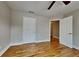 Bedroom featuring hardwood floors, neutral paint, and closet space at 1550 Royale Castle Dr, Lawrenceville, GA 30043