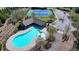 Community amenities include a pool, tennis court and parking with mature trees throughout the common areas at 2705 Fox Hunt Way, Cumming, GA 30041