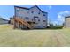 Large backyard with deck access, offering plenty of room for outdoor enjoyment and activities at 2705 Fox Hunt Way, Cumming, GA 30041