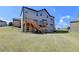 Spacious backyard with a wooden deck and stairs, offering ample space for recreation and entertaining at 2705 Fox Hunt Way, Cumming, GA 30041