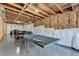 Large unfinished basement with ping pong table, exposed ductwork, and room for activities at 2705 Fox Hunt Way, Cumming, GA 30041