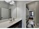 This bright bathroom features a spacious vanity and a connected bedroom at 2705 Fox Hunt Way, Cumming, GA 30041