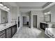 Spacious bathroom with double vanities, a soaking tub, and plenty of natural light at 2705 Fox Hunt Way, Cumming, GA 30041