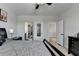 This bedroom boasts an ensuite bathroom, neutral paint and comfortable carpet at 2705 Fox Hunt Way, Cumming, GA 30041