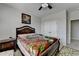 Comfortable bedroom with a plush bed, a side table, and a closet at 2705 Fox Hunt Way, Cumming, GA 30041