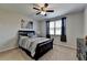 The spacious bedroom offers soft carpet, ample light, and a modern ceiling fan at 2705 Fox Hunt Way, Cumming, GA 30041