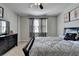 This charming bedroom offers natural light, neutral tones, and comfortable carpet at 2705 Fox Hunt Way, Cumming, GA 30041