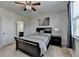 The bright bedroom features soft carpet, natural light, and ensuite bathroom access at 2705 Fox Hunt Way, Cumming, GA 30041
