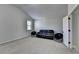 This bonus room features high ceilings, soft carpet, and ample natural light at 2705 Fox Hunt Way, Cumming, GA 30041