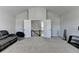 Open bonus room with neutral carpet and convenient access to the second floor at 2705 Fox Hunt Way, Cumming, GA 30041