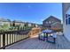 Wooden deck with a picnic table, perfect for outdoor dining and relaxation with community views at 2705 Fox Hunt Way, Cumming, GA 30041