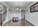 Elegant dining room features hardwood floors, wainscoting, and a chandelier at 2705 Fox Hunt Way, Cumming, GA 30041
