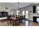 Open dining and living area with a view of kitchen, hardwood floors, and ample lighting at 2705 Fox Hunt Way, Cumming, GA 30041
