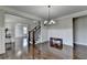 Elegant dining room features hardwood floors, wainscoting, and a chandelier at 2705 Fox Hunt Way, Cumming, GA 30041