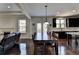 Dining and Living Room featuring wooden table with chairs and hardwood floors in open concept house at 2705 Fox Hunt Way, Cumming, GA 30041