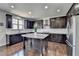 Modern kitchen with stainless steel appliances, granite countertops, and a functional island at 2705 Fox Hunt Way, Cumming, GA 30041