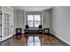 Bright, spacious living room with hardwood floors, windows and seating at 2705 Fox Hunt Way, Cumming, GA 30041