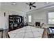 Spacious living room features a fireplace, tray ceiling and dark hardwood floors at 2705 Fox Hunt Way, Cumming, GA 30041