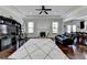 Spacious living room features a fireplace, tray ceiling and dark hardwood floors at 2705 Fox Hunt Way, Cumming, GA 30041