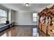 Bright, spacious living room with hardwood floors and detailed ornate cabinet at 2705 Fox Hunt Way, Cumming, GA 30041