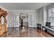 Bright, spacious living room with hardwood floors, windows and french doors at 2705 Fox Hunt Way, Cumming, GA 30041