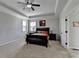 Spacious main bedroom features a tray ceiling, ceiling fan, and large windows with plenty of light at 2705 Fox Hunt Way, Cumming, GA 30041